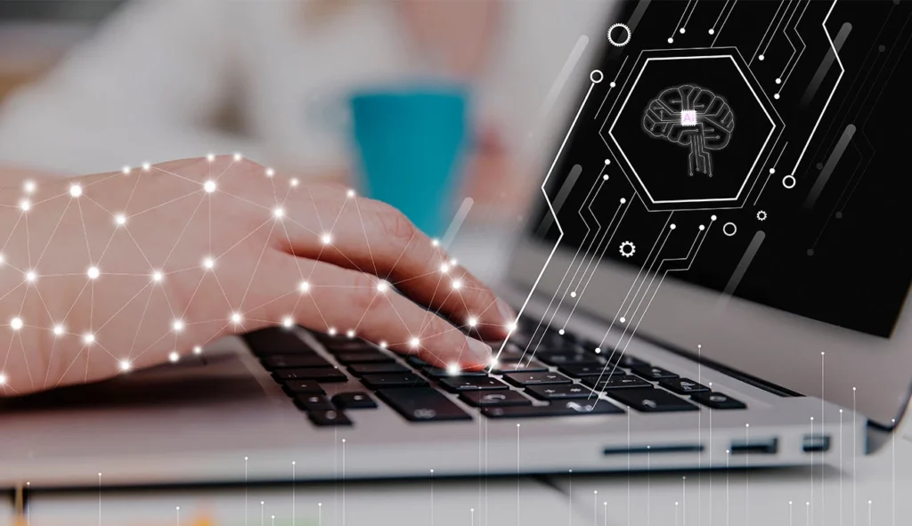 Projektantka pracująca na laptopie z symbolem sztucznej inteligencji – czy AI zastąpi kreatywnych specjalistów? Temat analizowany przez Weronikę Wolską w Akademii Projektowania i Kursie Projektowania Graficznego